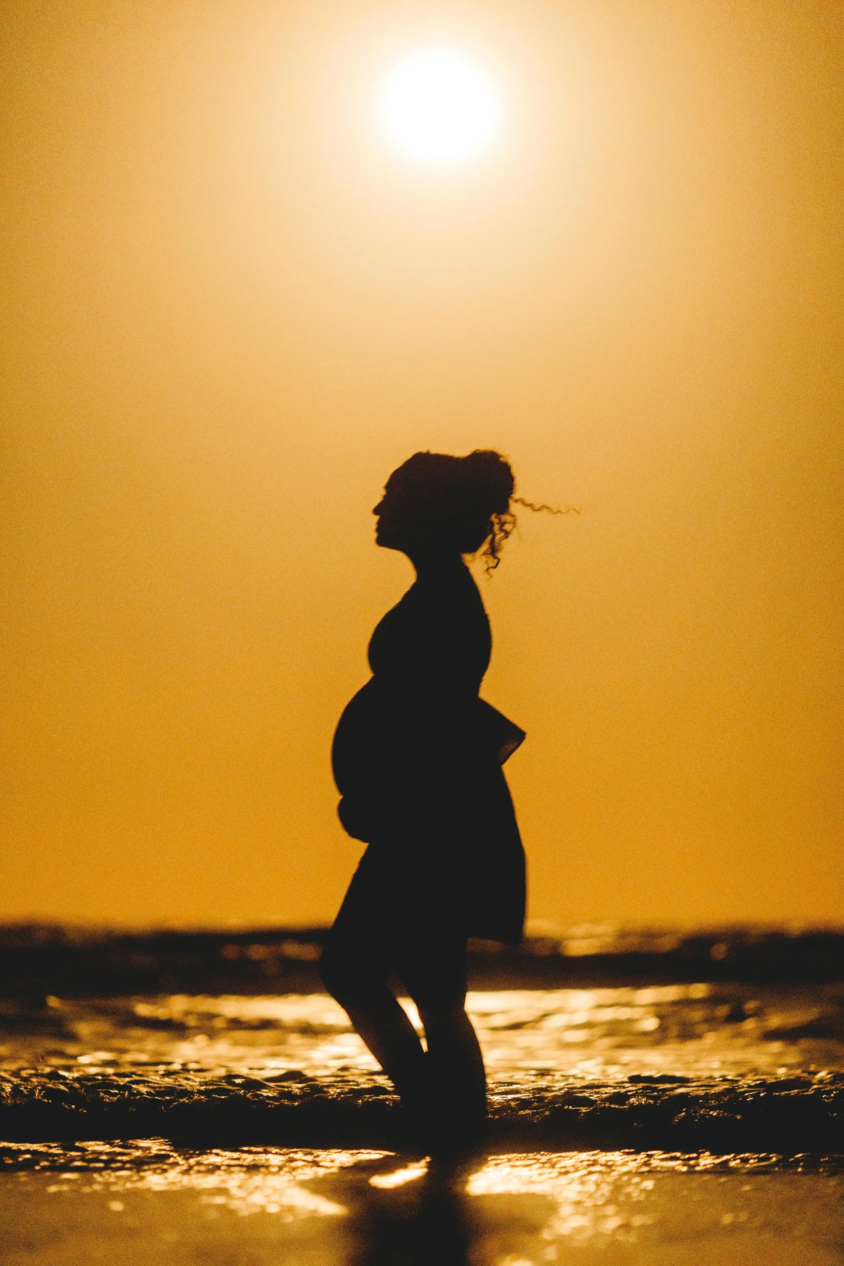 pregnant silhouette sunset beach